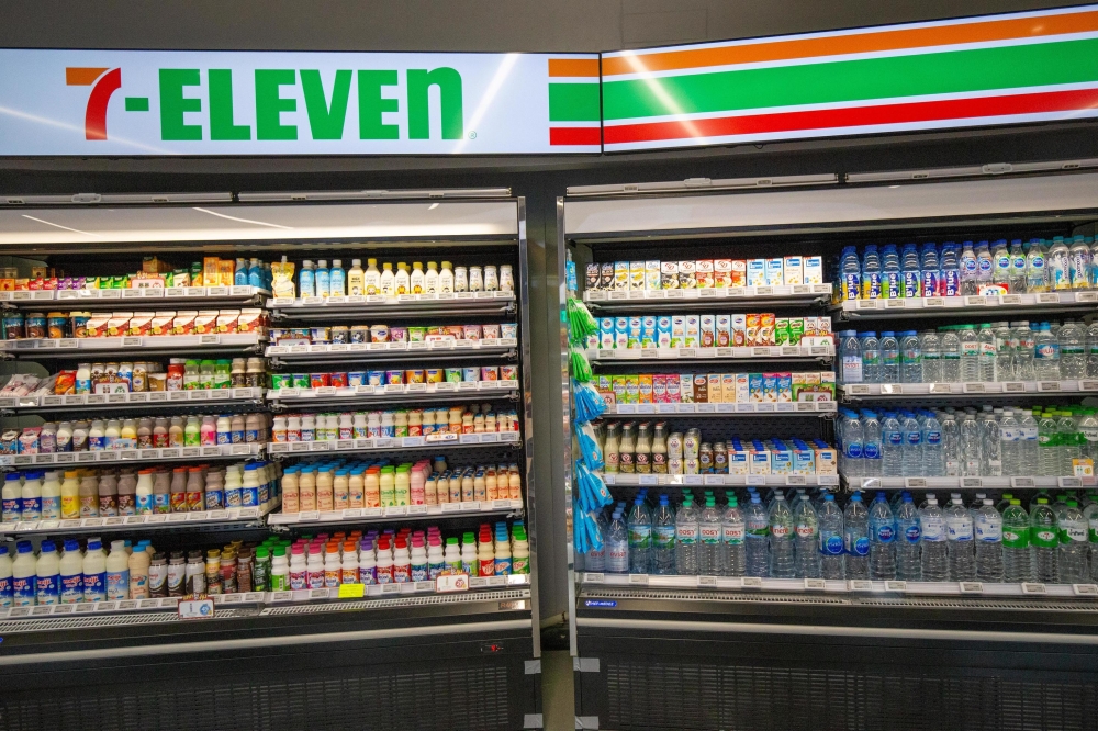 A typical 7-Eleven Thailand drinks chiller — ground zero for the Meiji milk raids that My Thailand joked about. — Vecteezy pic