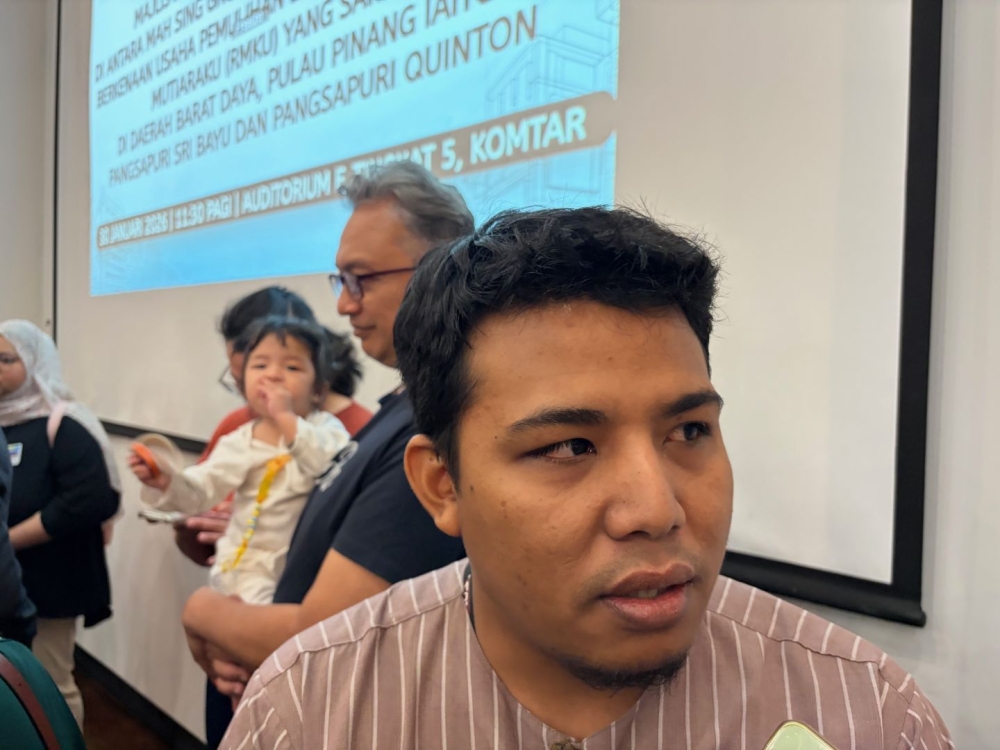 Nurzaim Zainudin said he has to work two jobs to pay for his housing loan and his rental while supporting his family. — Picture by Opalyn Mok