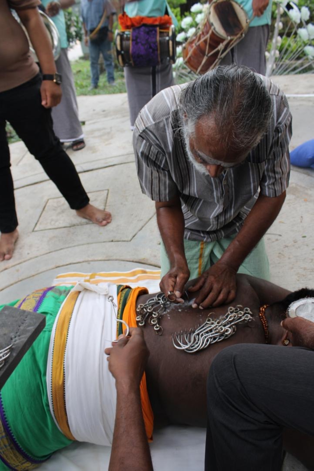 Asokan Muniandy, 63, prepares his son Kuhanraj’s ‘kavadi’ piercings during Thaipusam. — Picture courtesy of Kuhanraj Asokan