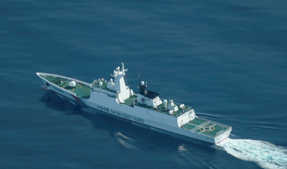 China conducts naval and air patrols around contested Scarborough Shoal in South China Sea