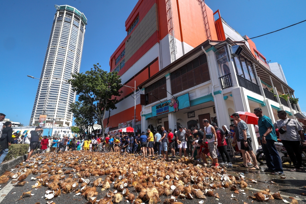 Coconuts broken by Hindu devotees are seen along Jalan Datuk Keramat in George Town January 31, 2026. — Bernama pic