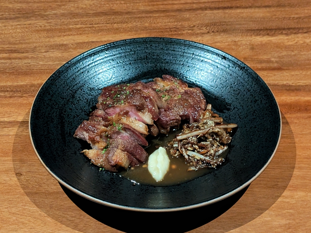 The aged pork collar is a riff of pig stomach pepper soup, and it is the highlight of the menu. — Picture by Ethan Lau 