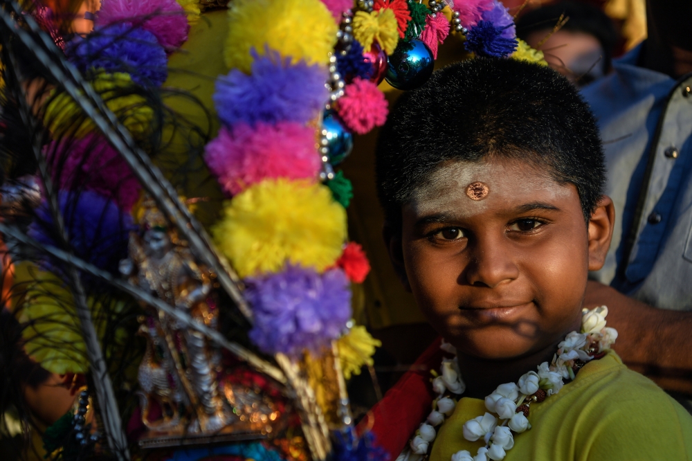 A young Hindu devotee smiles at the camera while taking part in Thaipusam rituals at the Sri Subramaniya Swami Devasthanam Temple in Sungai Petani today. — Bernama pic