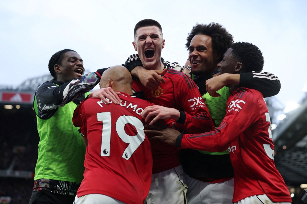 Manchester United’s Benjamin Sesko celebrates scoring their third goal with teammates during their Premier League match with Fulham at Old Trafford in Manchester February 1, 2026. — Reuters pic