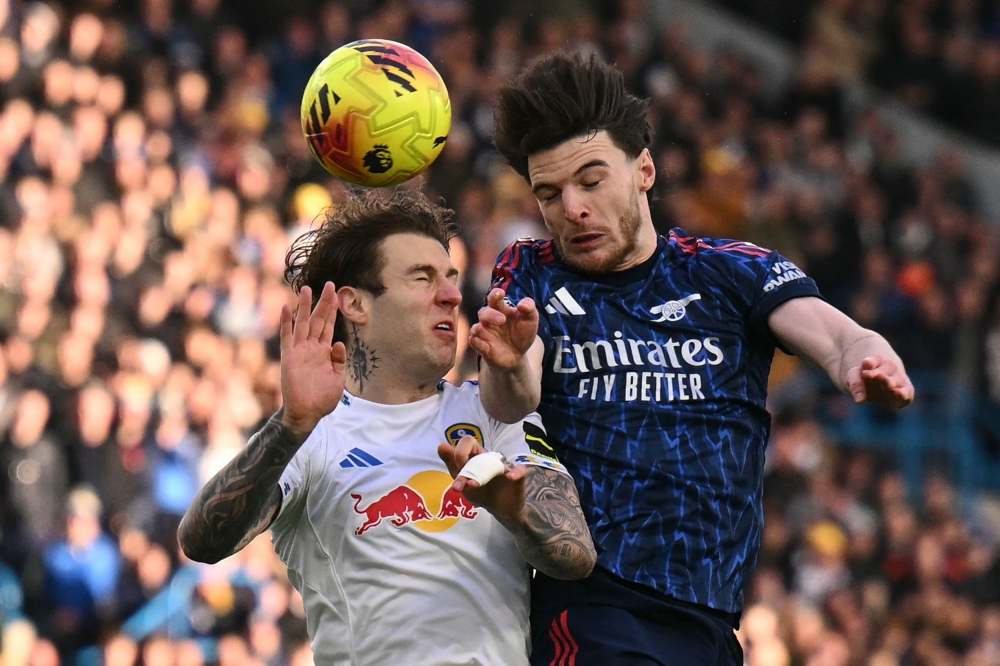 Leeds United’s Joe Rodon vies with Arsenal’s Declan Rice during their Premier League match at Elland Road in Leeds January 31, 2026. — AFP pic