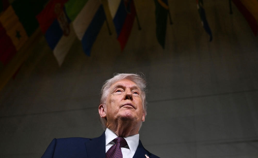 US President Donald Trump speaks to journalists as he attends the world premiere of Amazon MGM Studios’ ‘Melania’ at the Kennedy Centre in Washington January 29, 2026. — AFP pic