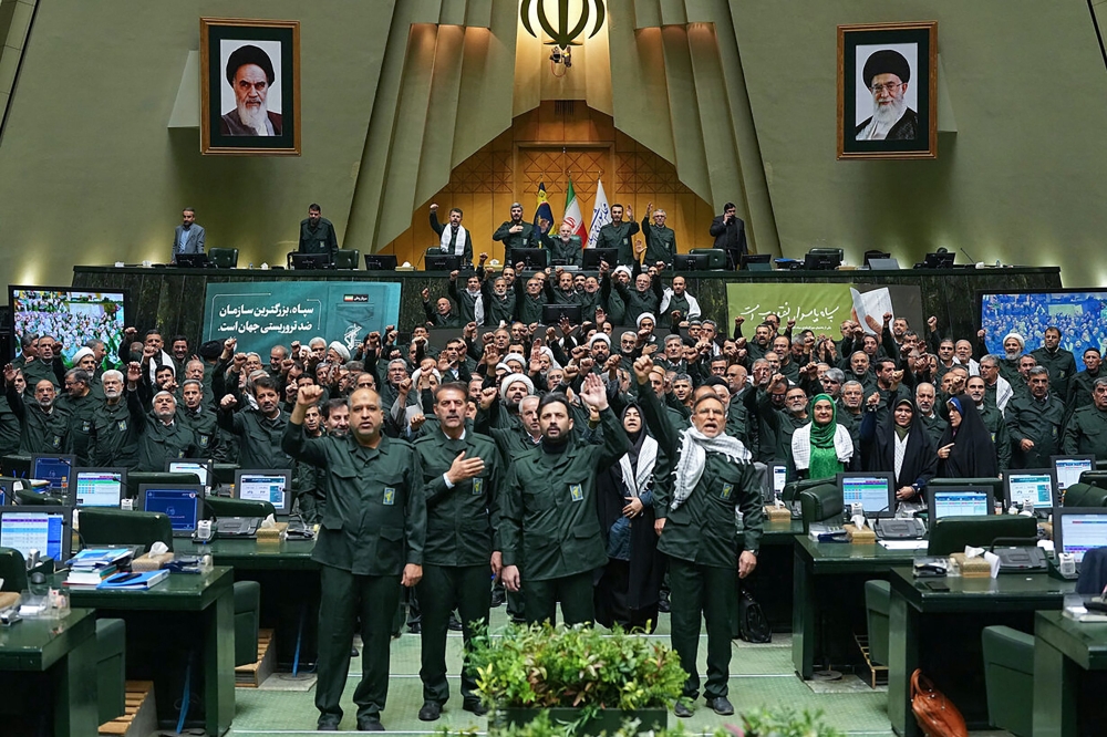 In this handout picture provided by the Islamic Consultative Assembly News Agency (ICANA), members of Iran's parliament dressed in IRGC uniforms, chant ‘Death to America’ during a session in Tehran on February 1, 2026. — Islamic Consultative Assembly News Agency handout/AFP pic