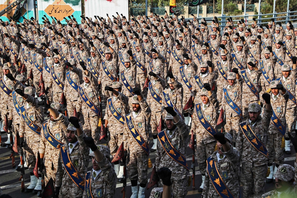 This handout file picture provided by the Iranian presidency on September 22, 2019 shows members of Iran's Islamic Revolutionary Guard Corps (IRGC) giving a military salute during a military parade in Tehran. — Iranian Presidency handout pic via Reuters 