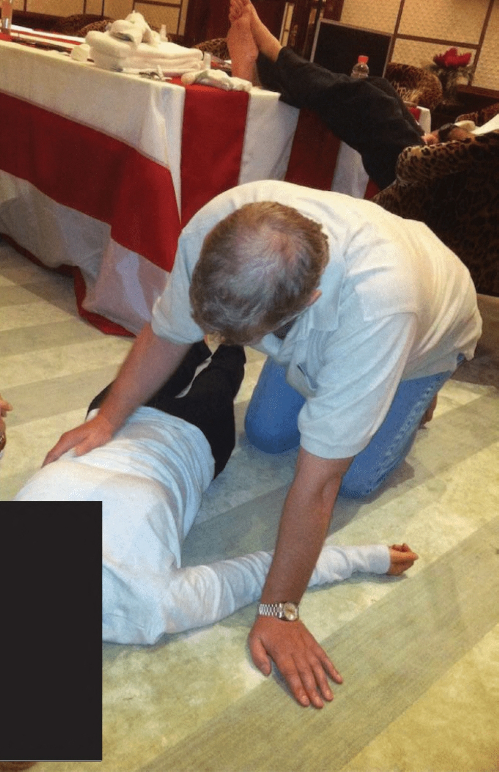 This undated photo at an undisclosed location released by the US Justice Department on January 30, 2026 as part of the Jeffrey Epstein files shows British former prince Andrew Mountbatten-Windsor kneeling over a woman lying on the floor. — US Department Of Justice handout/AFP pic 