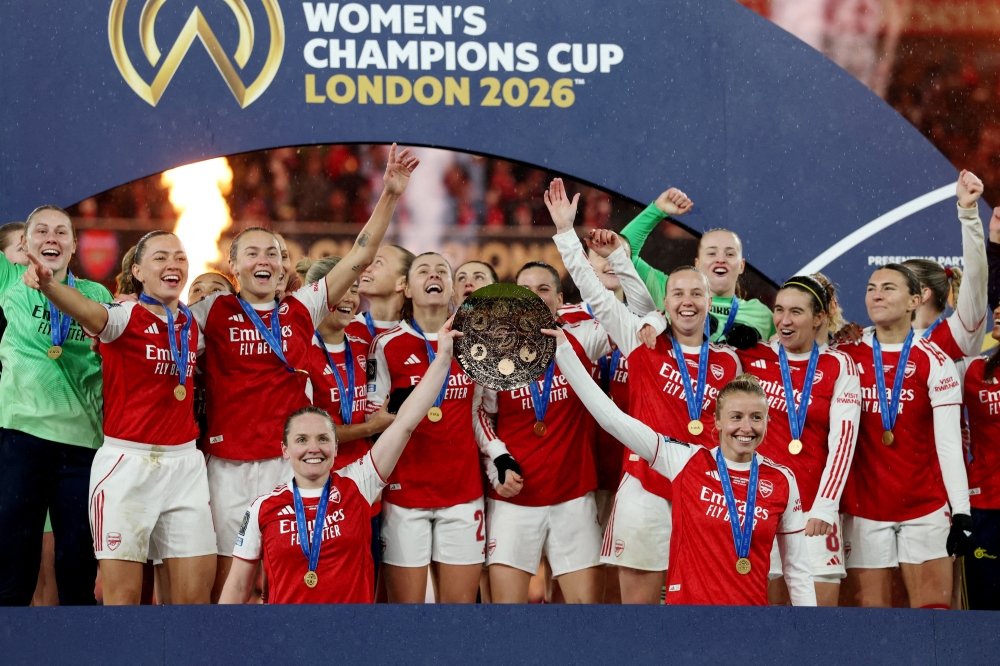 Arsenal’s Kim Little and Leah Williamson lift the trophy with teammates after winning the Fifa Women’s Champions Cup at the Emirates Stadium in London February 1, 2026. — Reuters pic