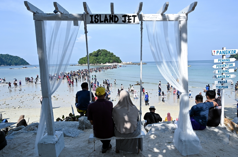 Pangkor Police Station chief Inspector Muhamad Faizol Kamaluddin said 17 officers, including tourist police personnel, were deployed around the beach area to ensure safety. — Bernama pic
