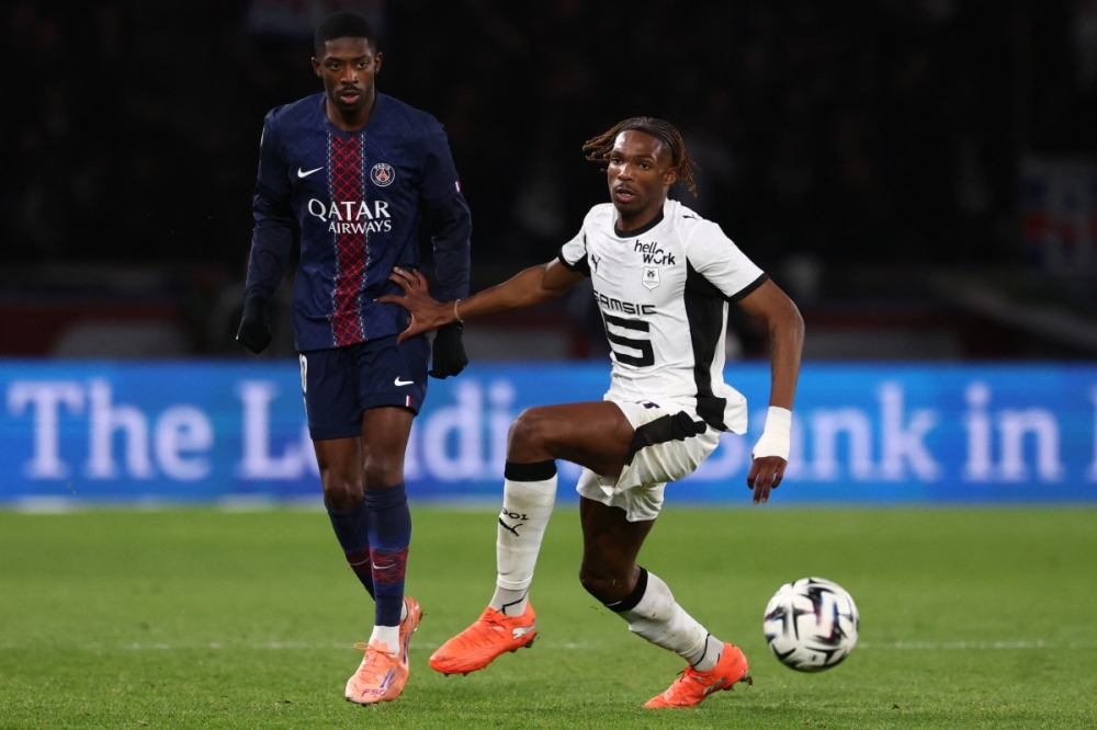 (From left) Paris Saint-Germain’s French forward #10 Ousmane Dembele and Rennes’ French defender #97 Jeremy Jacquet fight for the ball during the French L1 football match between Paris Saint-Germain (PSG) and Stade Rennais FC at the Parc des Princes stadium in Paris on December 6, 2025. — AFP pic