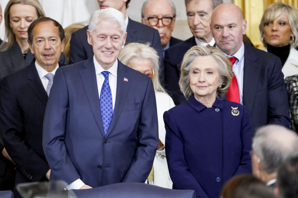 Former US President Bill Clinton and former US Secretary of State Hillary Clinton arrive for Donald Trump’s inauguration as the next president of the United States in the Rotunda of the United States Capitol in Washington January 20, 2025. — Reuters pic
