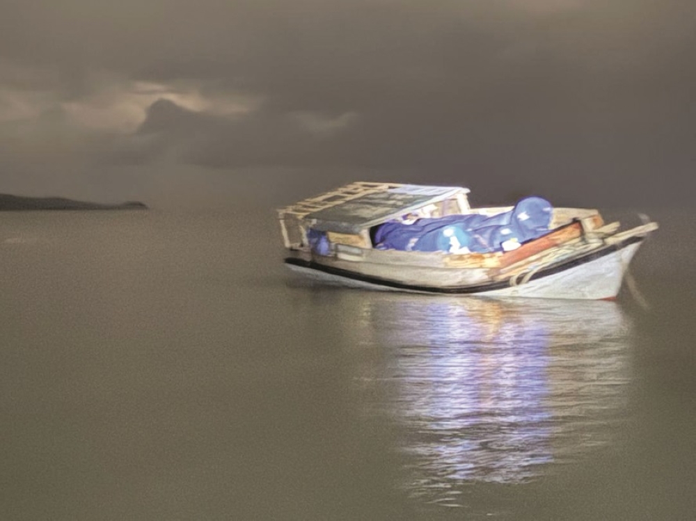 The seized boat is seen in a picture, after being found to be carrying 2,000 litres of petrol. — Daily Express pic