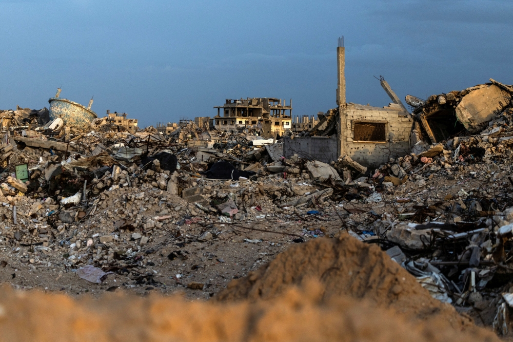 Buildings lie in ruins amidst the rubble in Rafah in the southern Gaza Strip, December 8, 2025. — Reuters pic