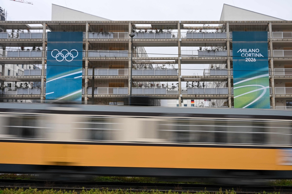 A train passes by the exterior of the Olympic Village ahead of the Milano Cortina 2026 Winter Olympics in Milan on February 3, 2026. — AFP pic 