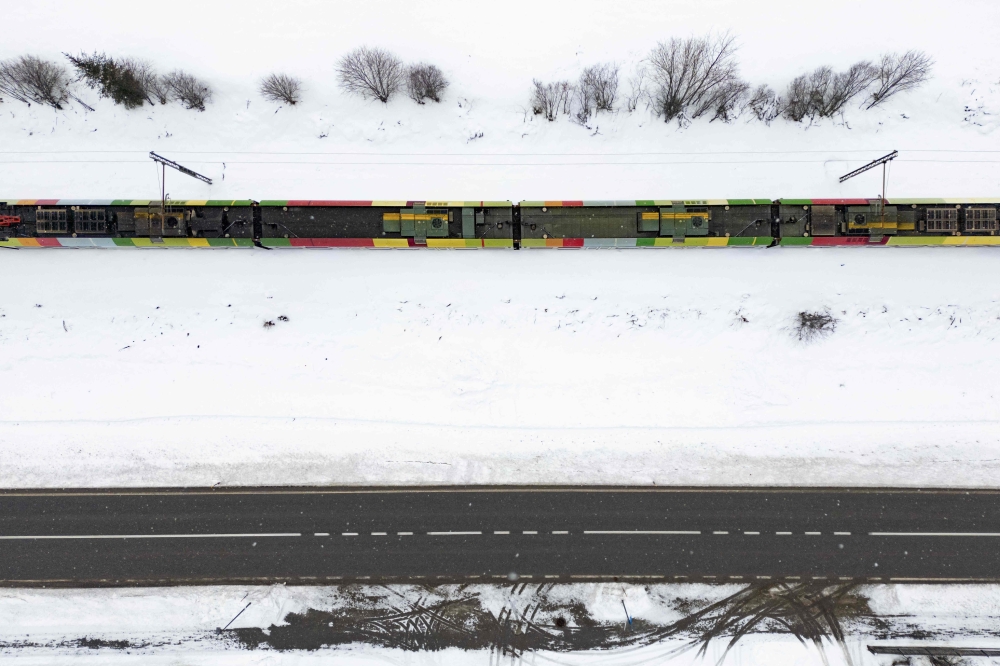 A local train travels along the track in the village of Niederdorf, between the Olympic venues in Cortina and Antholz, northern Italy prior to the Milano Cortina 2026 Olympic Games, on January 29, 2026. — AFP pic 