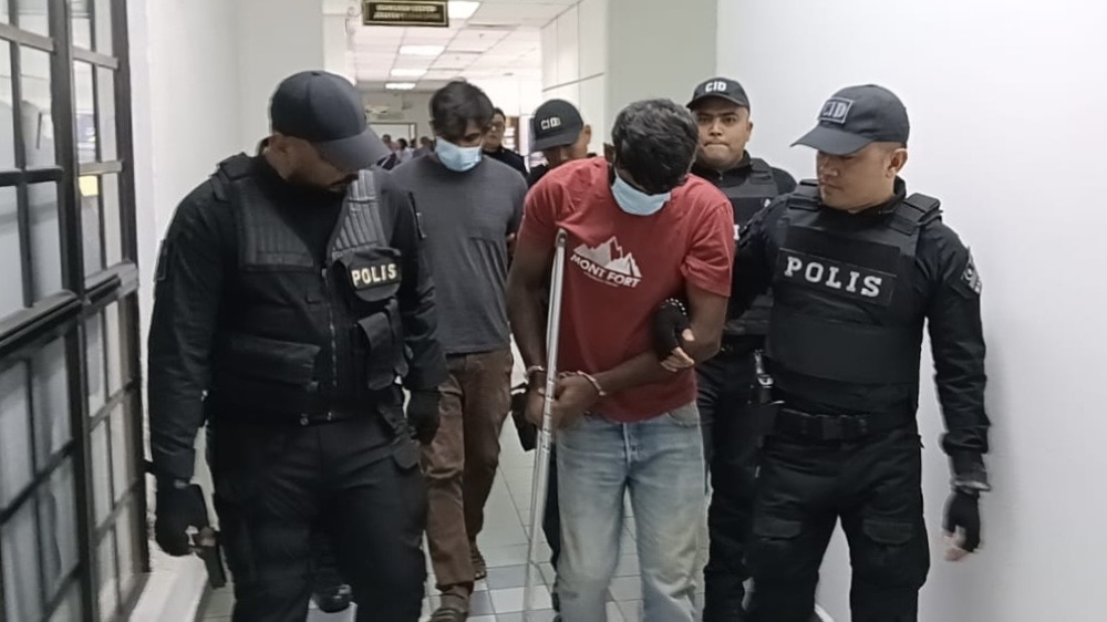 Johor Bahru Magistrates’ Court charges brothers with Kangkar Pulai murder after charred house discovery