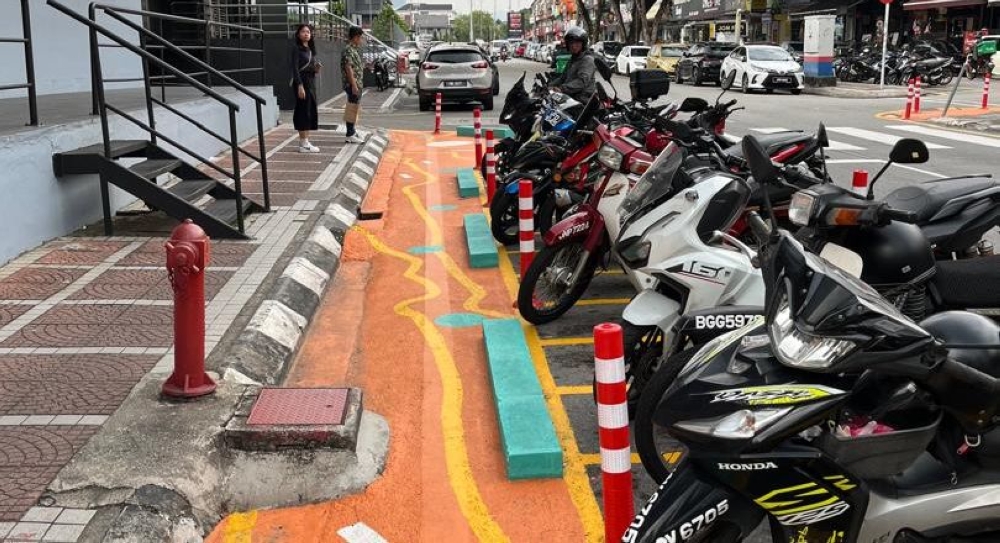 Motorcycle parking spaces have been created directly beside a fire hydrant in Taman Tun Dr Ismail. — TTDI Residents Association pic
