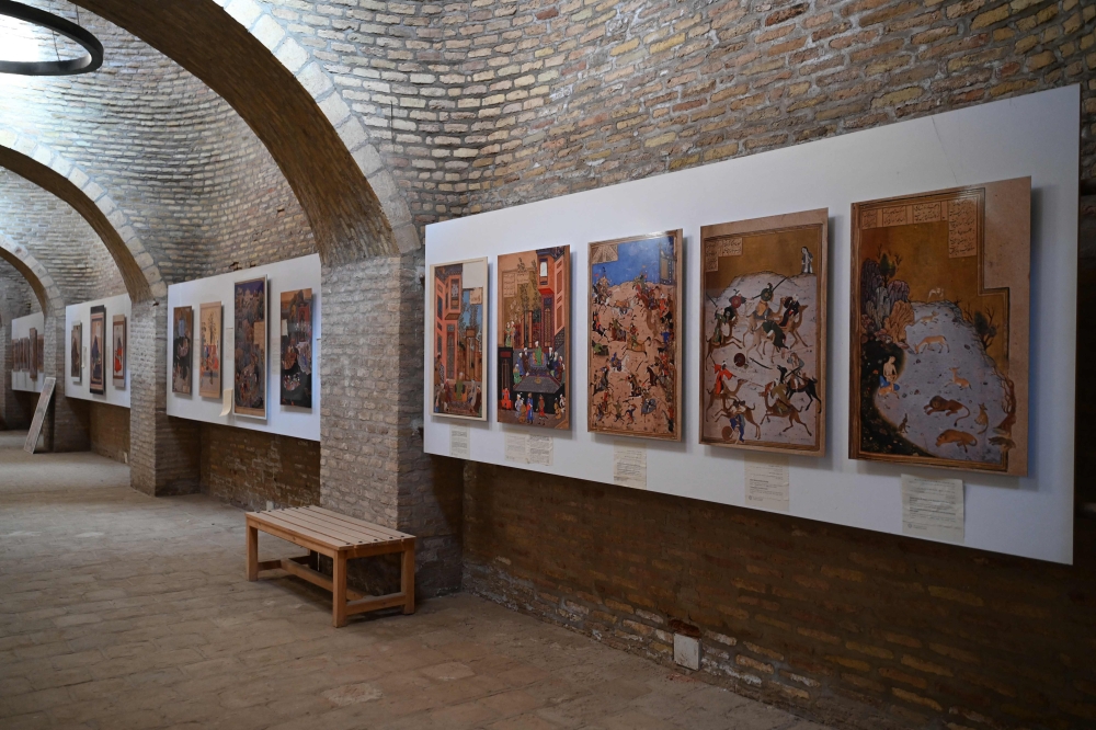This picture taken on January 7, 2026 shows miniature art by painter Kamal ud-Din Behzad displayed at the Citadel of Alexander, also locally known as Qala Iktyaruddin in Herat. Hundreds of years after the celebrated painter Kamal ud-Din Behzad roamed the streets of Herat, artists in the Afghan city are finding joy and hope in his recognition by Unesco. A contemporary of Italian masters Leonardo da Vinci and Sandro Botticelli, Behzad brought a new style to Herat before settling west of there, in Tabriz, in modern-day Iran. — AFP pic