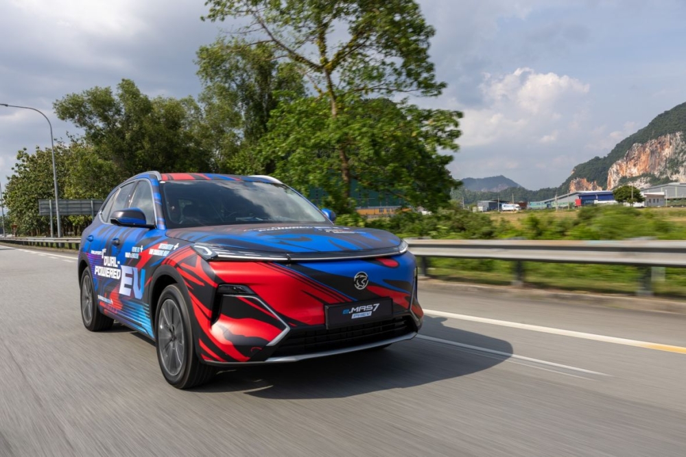 New national carmaker SUV switches intelligently between electric and petrol power with 8-year battery warranty. — Proton e.MAS Cars pic