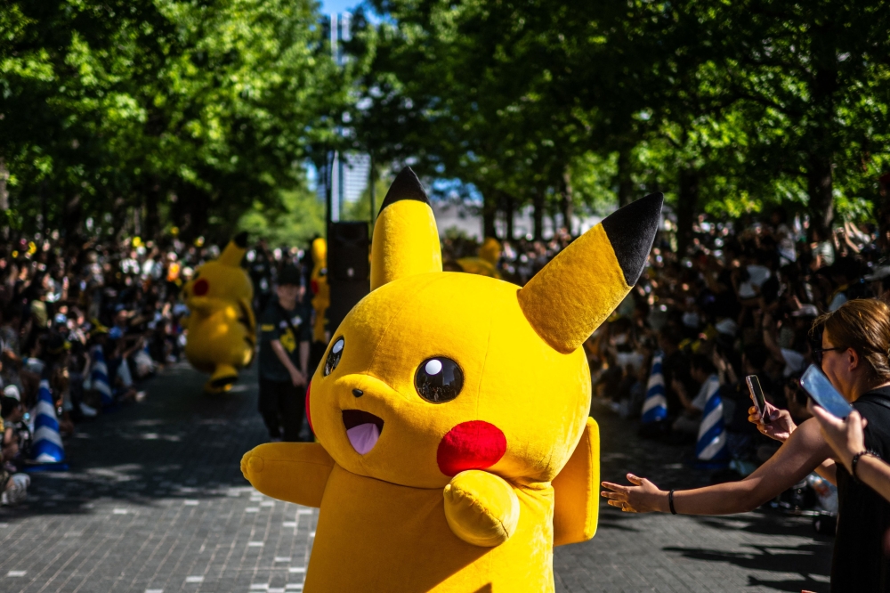 People watch the Pikachu parade which is a part of the 2023 Pokemon World Championships, at Grand Mall Park in Yokohama on August 11, 2023. — AFP pic
