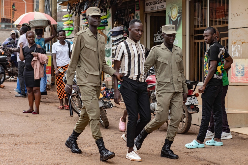 Ugandan police officers arrest an opposition supporter taking part in a demonstration against alleged election fraud and in support of opposition figures in Kampala on February 2, 2026. — AFP pic