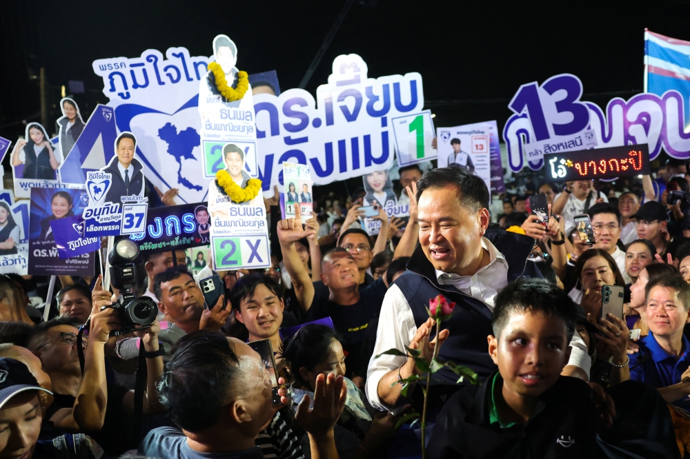 Thailand’s caretaker Prime Minister Anutin Charnvirakul, who is the Bhumjaithai Party leader and prime ministerial candidate, reacts with supporters during a general election campaign rally in Bangkok on January 30, 2026. — Reuters pic