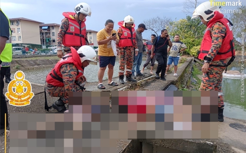 Police are conducting further investigations to determine the cause of the drowning of three children in a sewage pond behind Block M flats in Sibu Jaya Wednesday afternoon. — Picture courtesy of Fire and Rescue Department 
