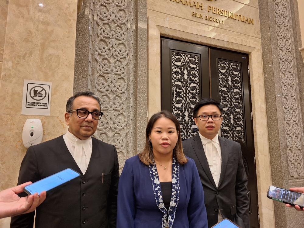 (From left to right) Lawyer Datuk Malik Imtiaz Sarwar, activist Heidy Quah, and lawyer New Sin Yew speaking to reporters after the Federal Court’s decision on Section 233 of the Communications and Multimedia Act. — Picture by Ida Lim