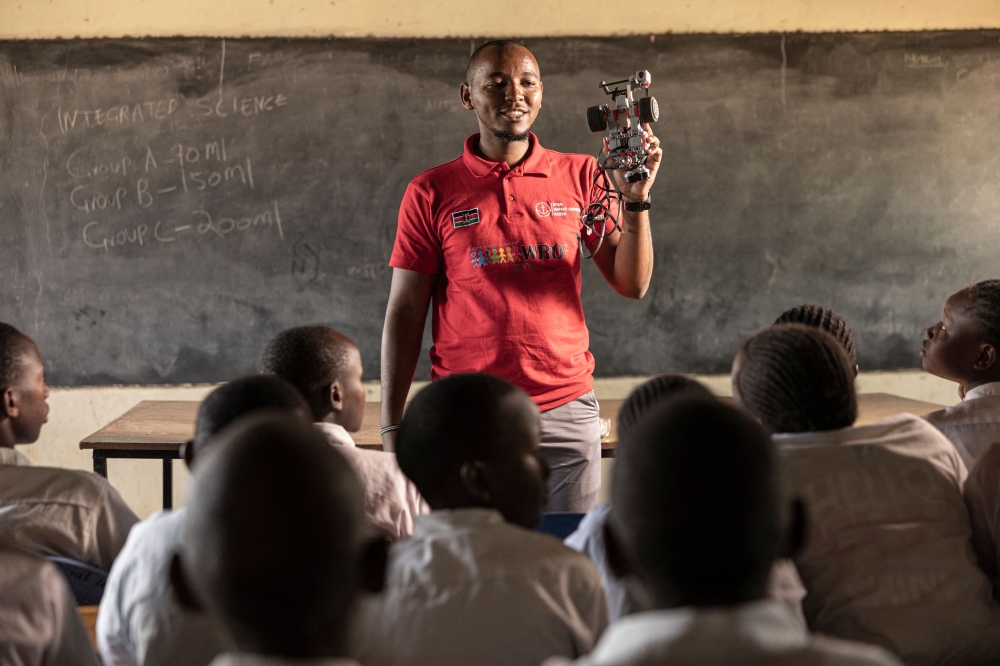 Programmes cordinator of the Science in a Suitcase project, Jeremiah Kithinji instructs his students at the science club on how to assemble the Lego mindstorms EV3 robot, at the Muramati Primary School in Nanyuki, Laikipia county on January 28, 2026. — AFP pic 