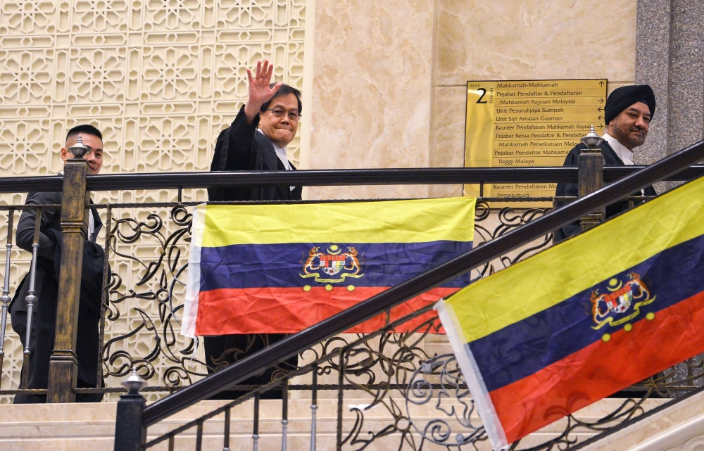 Lawyer representing former Tronoh MP Paul Yong Choo Kiong, Datuk Hisyam Teh Poh Teik (centre), attends the hearing of a leave application by Paul Yong Choo Kiong to review the decision of a previous Federal Court panel that upheld his conviction and sentence for the rape of his domestic helper seven years ago February 6, 2026. — Bernama pic