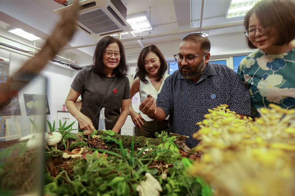 Professor Dr S.S. Jaya Seelan (second from right) interacts with visitors at the Friends of Fungi and Slime Mold exhibition at Jaya One. — Picture by Sayuti Zainudin