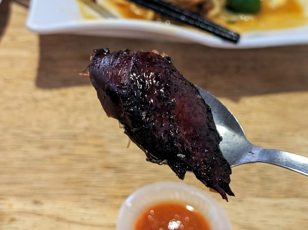 The sauce is so thick that it becomes a glaze on the chicken skin. — Picture by Ethan Lau