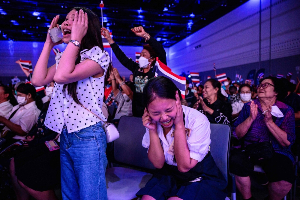 Supporters cheer as Thailand’s Prime Minister and Bhumjaithai Party leader Anutin Charnvirakul speaks during a campaign event in Bangkok on February 6, 2026. — AFP pic