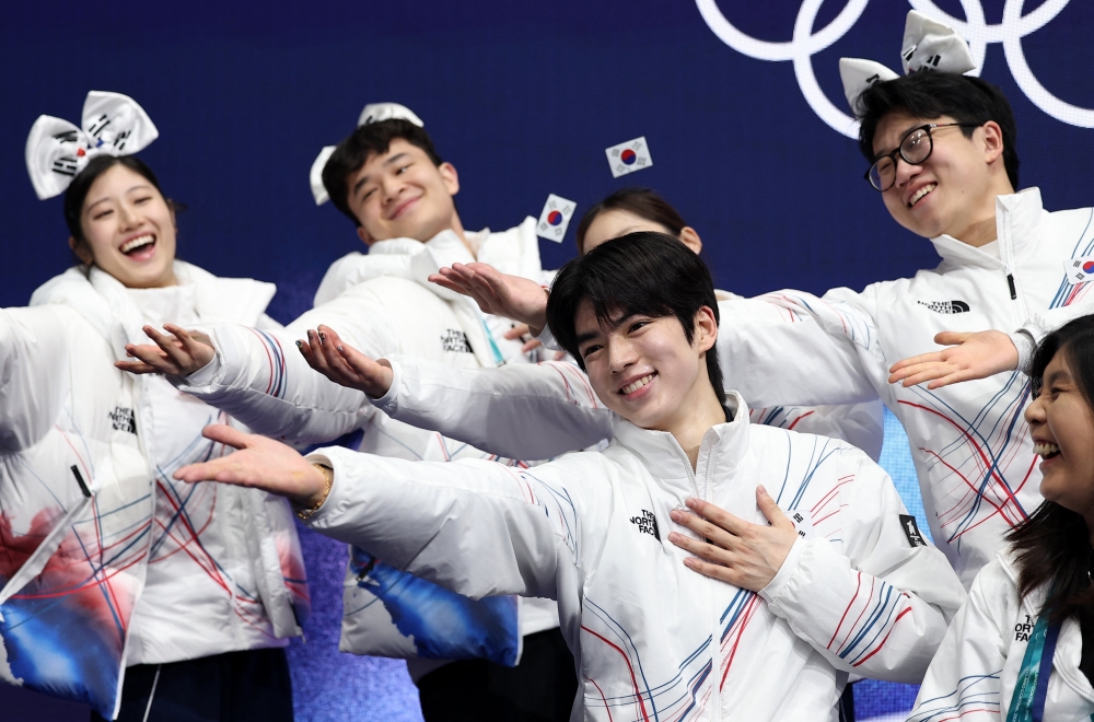 Cha Jun-hwan reacts with his team after performing during the men’s short programme at the 2026 Milan Cortina Winter Olympics in Milan February 7, 2026. — Reuters pic