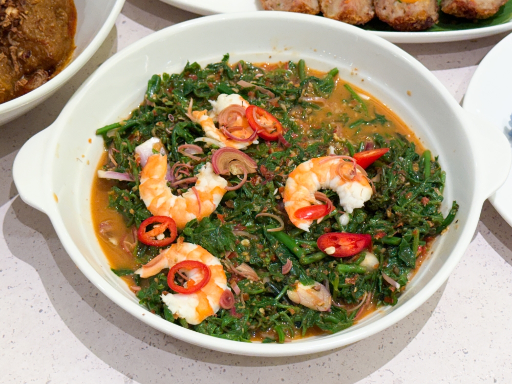 Kerabu Pucuk Paku is packed with flavour with the ferntops cooked in a ‘belacan’ based sauce. — Picture by Lee Khang Yi