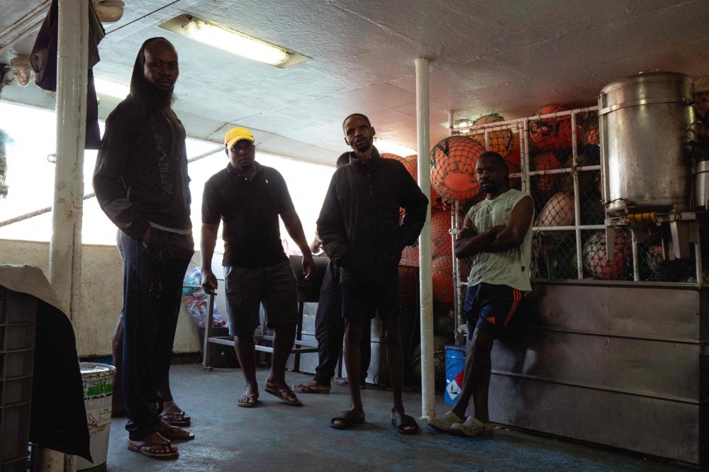 Angolan nationals Vitorino T.T. Nguli (L), Pedro (2nd L), Jose Viti (2nd R) and Luis Tchi-Soma, crew members of the tuna longliner fishing vessel Novo Ruivo who sails under a Portuguese flag, pose for a picture at the Porto Grande port in Mindelo on February 5, 2026. — AFP pic