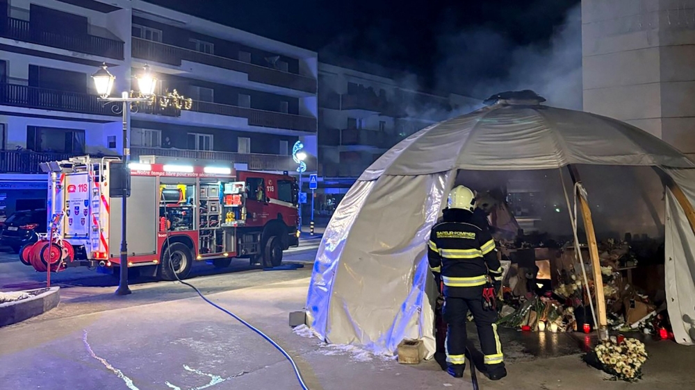 This handout photograph taken and released by the Swiss Valais cantonal Police department on February 8, 2026, shows firefighters working to extinguish a fire at a memorial site in front of the bar ‘Le Constellation’ in tribute to the victims of the fatal fire that ravaged the bar on New Year’s Eve in Crans-Montana. — AFP pic