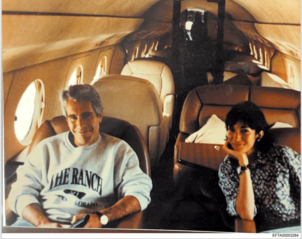 This undated photo provided by the US Justice Department on December 19, 2025 shows Jeffrey Epstein, a wealthy US financier who died in jail in 2019 while awaiting trial for sex trafficking underage girls, and his associate, Ghislaine Maxwell aboard a jet. — US Department of Justice handout via AFP