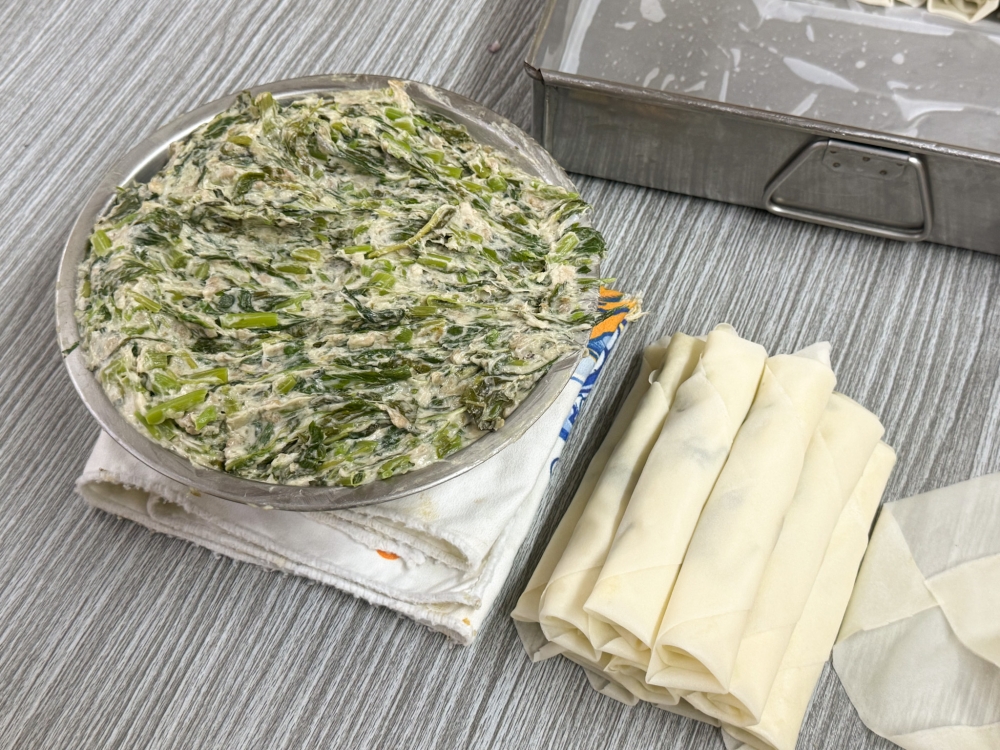 Spring rolls are stuffed with a mixture of spinach and fish paste. — Picture by Lee Khang Yi
