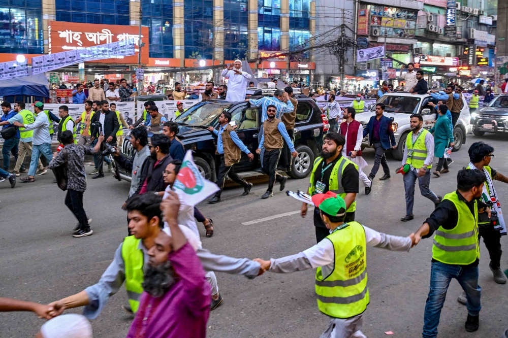 Shafiqur Rahman (centre), a leader of Jamaat-e-Islami, Bangladesh’s largest Islamist party, waves to supporters during a rally on the final day of campaigning in Dhaka on February 9, 2026 ahead of the country's general election on February 12. — AFP pic