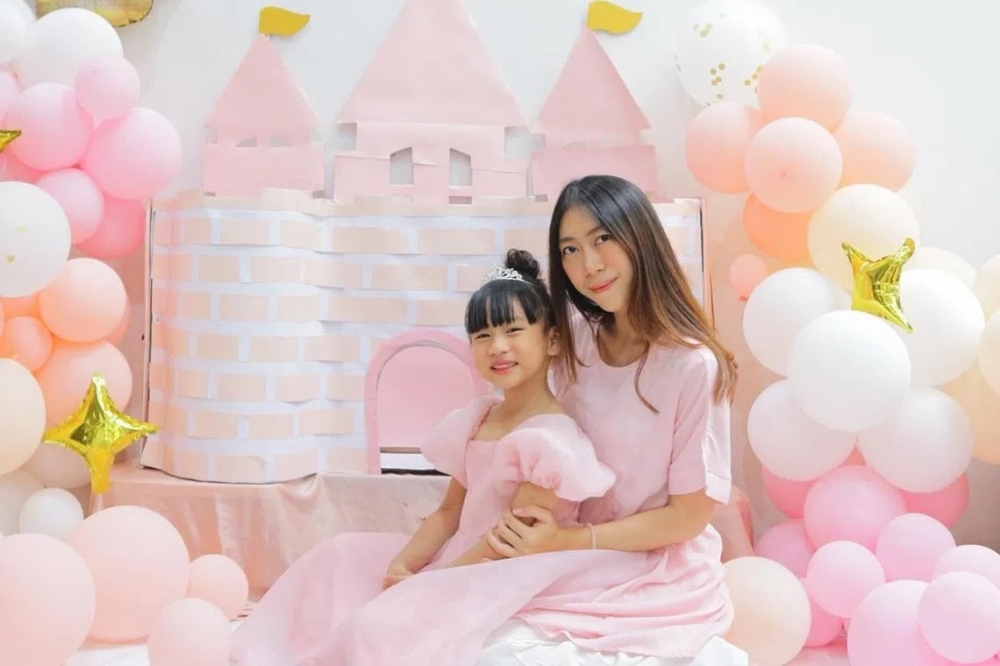 Raisha Anindra Pascasiswi is seen in a social media post with her daughter, Sheyna Lashira Smaradiani. They were hit by a car in Singapore's Chinatown, with Sheyna latter dying from her injuries. — Picture via Instagram