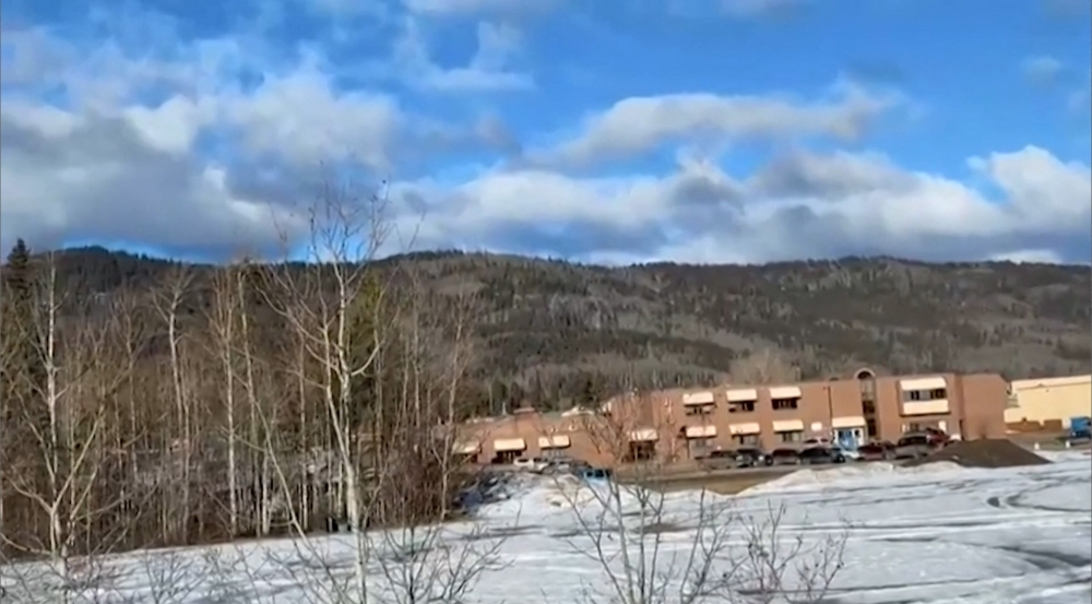 This screengrab of a video provided by local journalist Trent Ernst shows the middle school and high school building where a shooting took place, leaving at least nine people dead in the small town of Tumbler Ridge, British Columbia, on February 10, 2026. — Photo by Trent Ernst via AFP