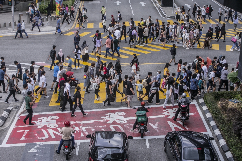 Visitors and tourists are seen crowding around Bukit Bintang city center to take advantage of the New Year holidays. As usual, Bukit Bintang is a popular location for people in the capital to visit, especially during public holidays and the festive season January 1, 2023. — Picture by Hari Anggara