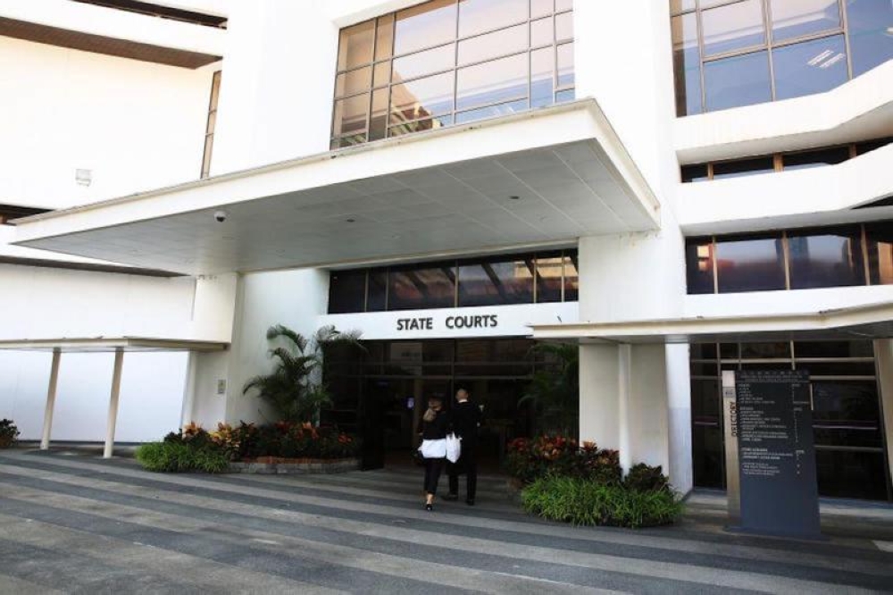 Two Malaysian men pleaded guilty in court yesterday to repeatedly entering Singapore to withdraw a total of S$1 million (RM3.1 million) in scam proceeds for a syndicate operating via Telegram chat groups. — TODAY pic