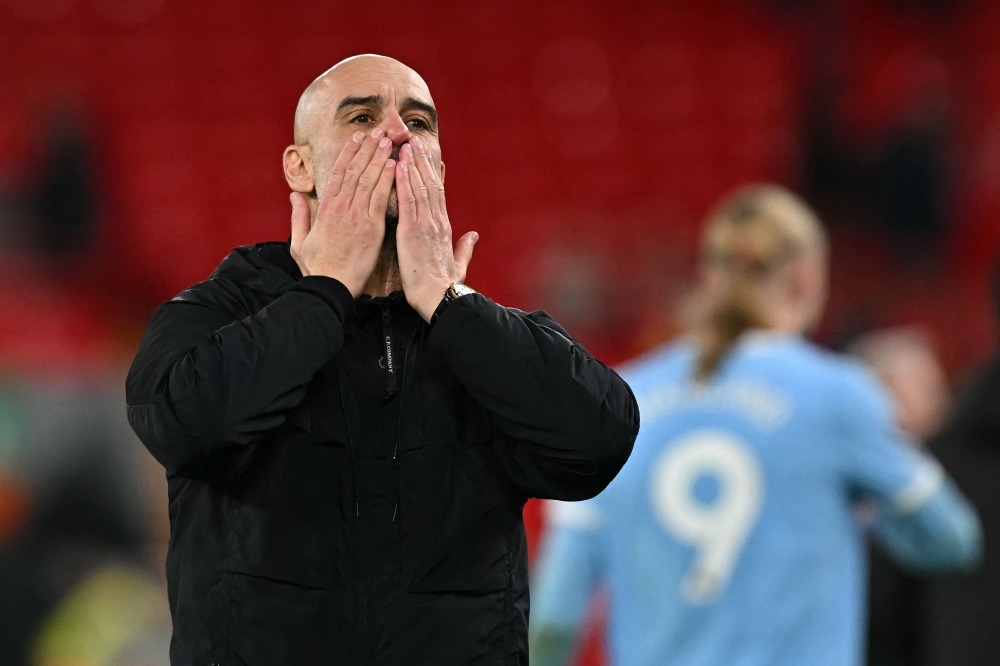 Manchester City's Spanish manager Pep Guardiola reacts at the end of his team's victory in the English Premier League football match between Liverpool and Manchester City at Anfield in Liverpool February 8, 2026. — AFP pic