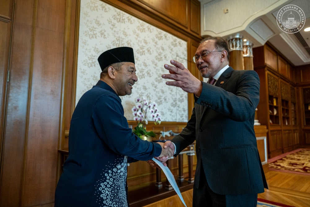 Prime Minister Datuk Seri Anwar Ibrahim greets Kelantan Menteri Besar Datuk Mohd Nassuruddin Daud at his office in Putrajaya, February 12, 2026. — Bernama pic 