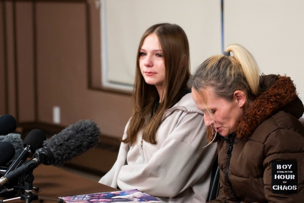 Niveya Lampert and her mother Sarah Lampert speak to the media after the loss of Ticaria Lampert, her sister who was killed in the Tumbler Ridge shooting on February 10, in Tumbler Ridge, British Columbia, on February 12, 2026. — AFP pic