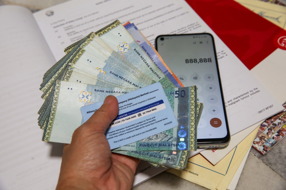 Look at what you need and what you can afford when buying medical insurance. — Picture by Choo Choy May 